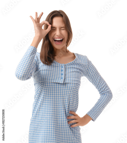 Young woman showing OK on w...