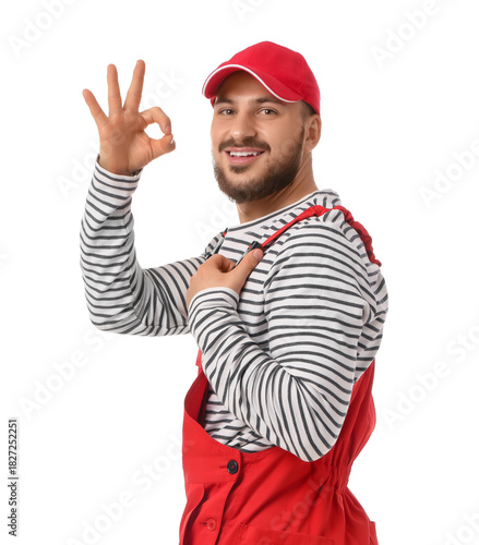 Male worker showing OK on w...