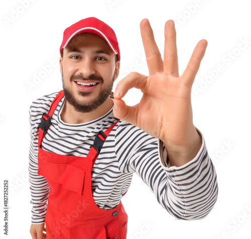 Male worker showing OK on w...