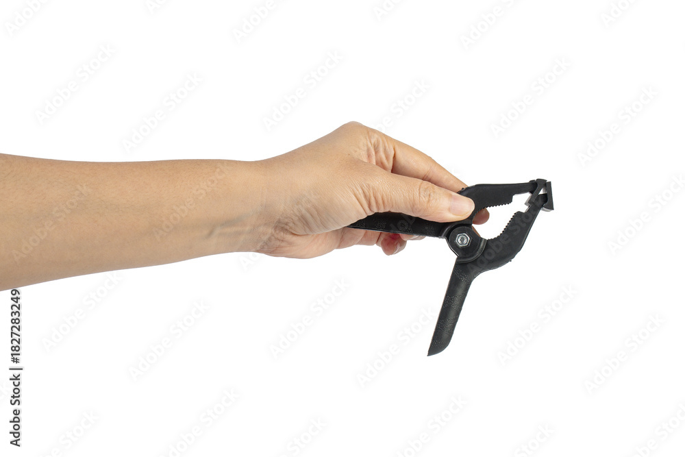 Fototapeta premium A studio shot of a black plastic spring clamp in hand isolated on a transparent background