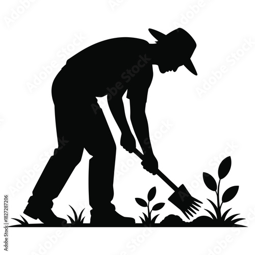 Silhouette of a farmer tending to his garden isolated on