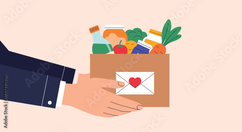 A person is extending a care package, a cardboard box filled with various groceries and a special envelope with a heart, symbolizing charity and support.