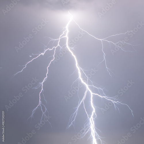 Bright vactor white lightning bolt strikes across grey stormy sky isolated on a transparent background