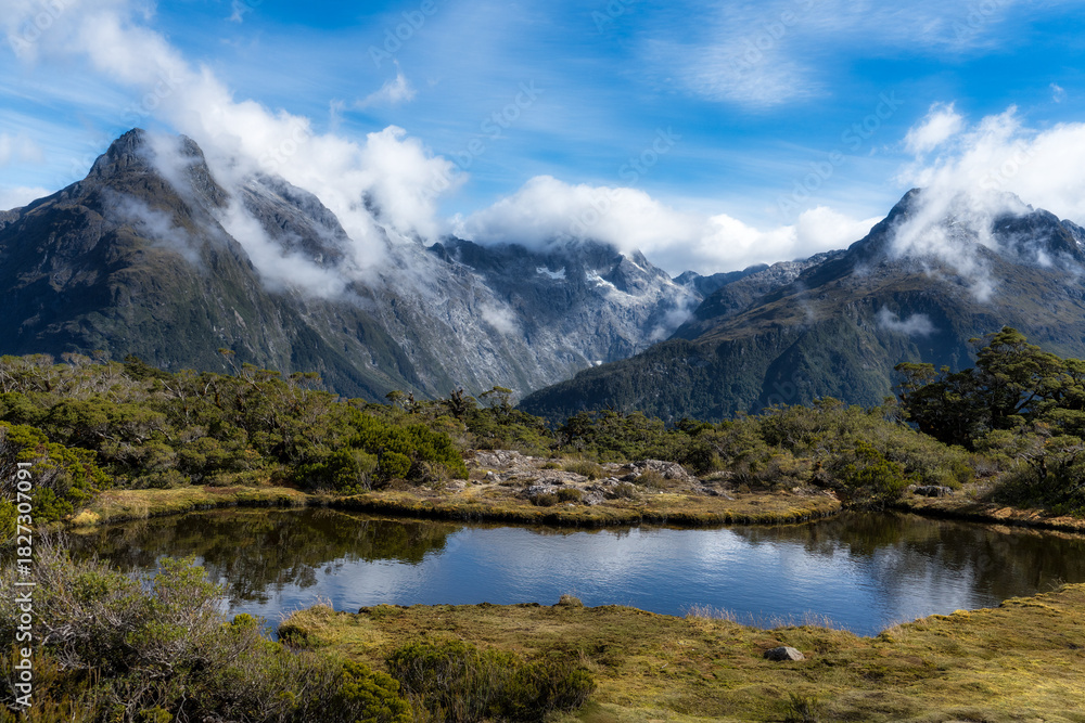 Fototapeta premium The alpine tarn at the top of The Key Summit, part of the Routeburn Track in New Zealand's Fiordland National Park