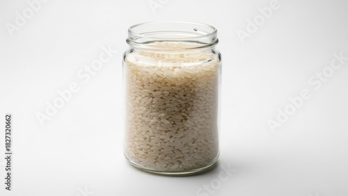 Jar of uncooked rice simple presentation on white for food storage and pantry organization concepts