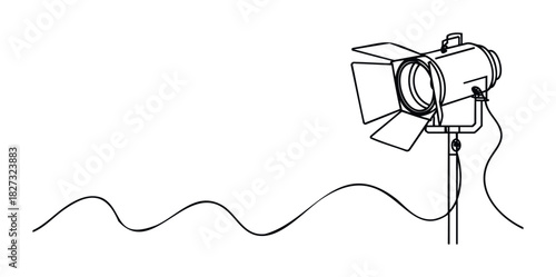 Vintage stage spotlight on a stand with a power cord creating a wavy line against a plain background, perfect for theatre or film production themes