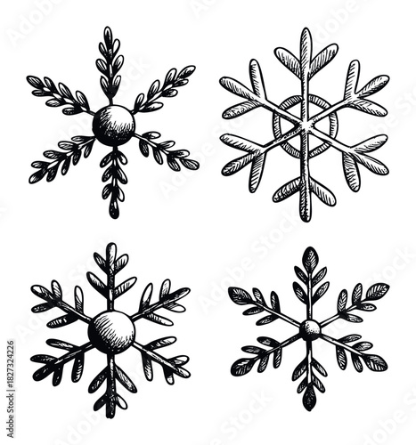 Set of hand drawn snowflake graphics in a scratchy black and white style perfect for winter holiday themes and seasonal invitations
