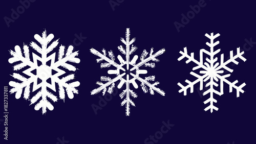 Three white snowflakes with a brush stroke texture on a dark blue background
