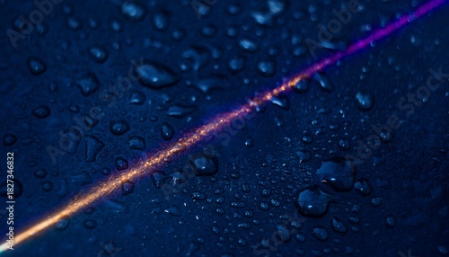 Close Up of Water Droplets on Dark Surface with Laser Beam in Blue Tones