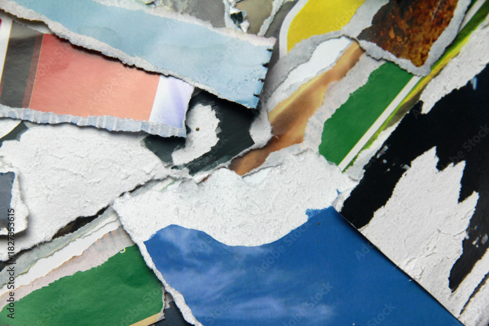 Fototapeta premium Multicolored poster paper, torn into numerous pieces.