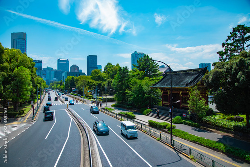 A cityscape of traffic jam at the city street in Tokyo in summer wide shot