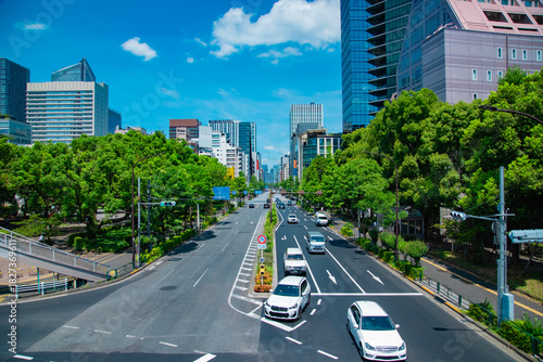 A cityscape of traffic jam at the city street in Tokyo in summer wide shot