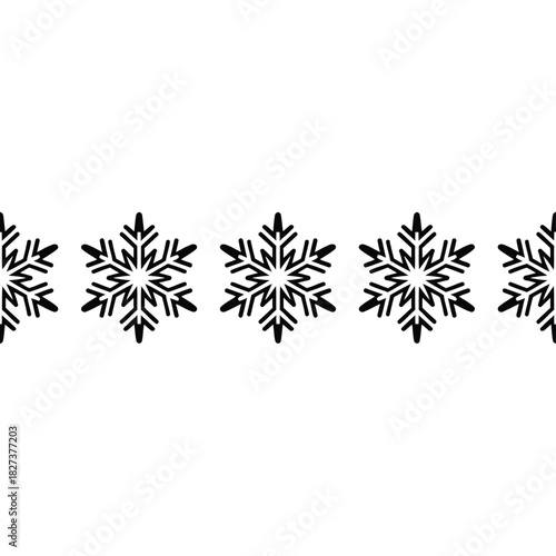 Seamless horizontal border of black snowflakes on a white background