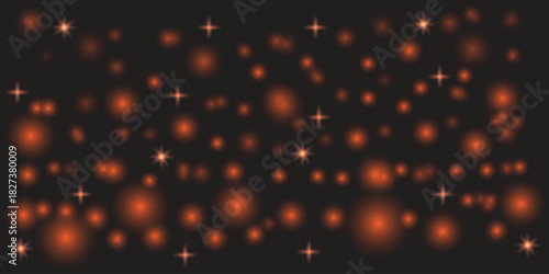 Bright Orange Light Bokeh Background on a Dark Background with Sparkle Effects