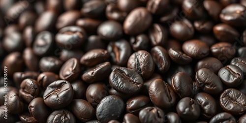 Dark roasted espresso beans, close-up showing rich texture and oil,  dark roast,  arabica