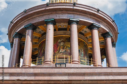 Siegessaule, the Victory Column in Berlin, Germany. Round hall with 16 granite columns above the base and below the column upon which stands bronze sculpture of Victoria.