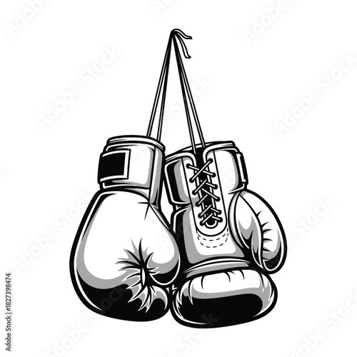Pair of classic boxing gloves in black and white hanging, showcasing sport equipment, combat readiness, training gear, and determination, perfect for fitness, strength, and challenge themes.