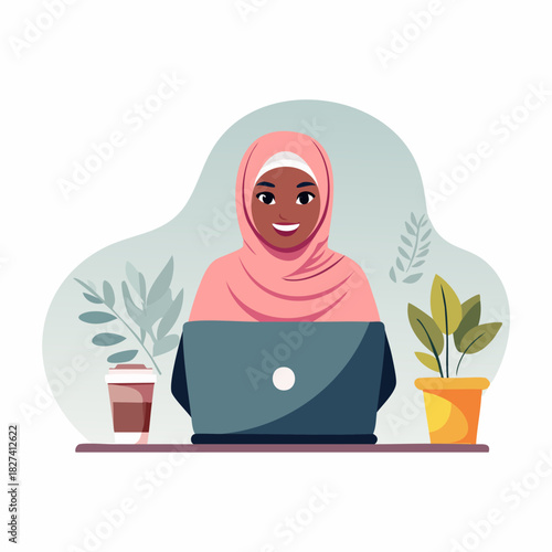 Woman in Hijab Using Laptop at Desk.