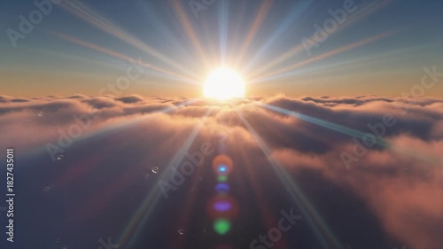 Aerial view golden sunrise above clouds light rays and lens flare effect