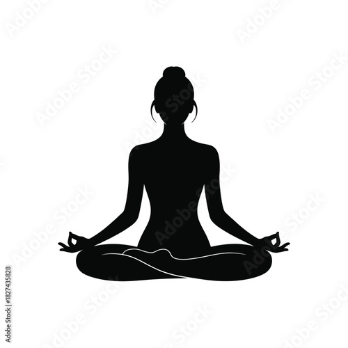 Silhouette of a woman meditating in lotus pose