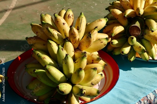 Wallpaper Mural yellow and green asian bananas on banana leaves and blurry background Torontodigital.ca