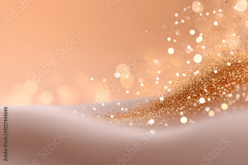 Soft abstract glitter dust with warm golden sparkles on a pastel background