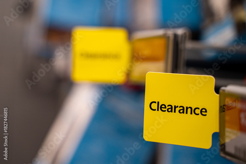 Close up of yellow clearance sign in retail store.