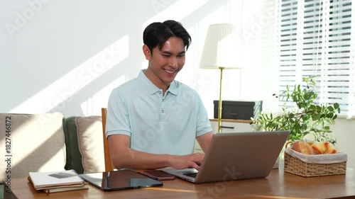 Lifestyle people, Man using laptop computer. Happy man, entrepreneur, small business owner working online at home office.