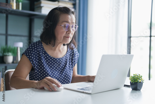 Mature Asian woman Work from home. senior asian woman on laptop with technology concept. Free Download Mature Asian woman Work from home. senior asian woman on laptop with technology concept. - GFXLoad
