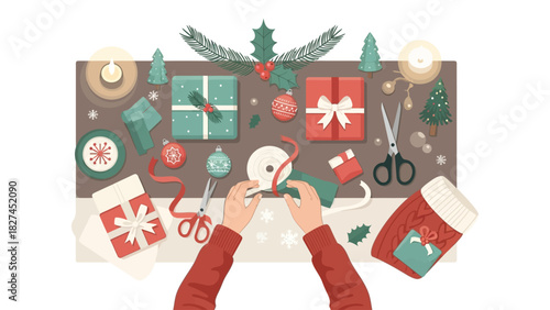 Overhead view of hands wrapping Christmas gifts with festive decorations and craft supplies.