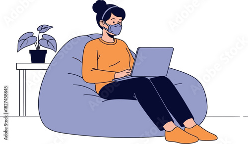 Smiling young businessman working casually on a laptop in the office