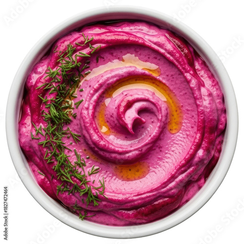 Vibrant pink beetroot hummus dip with olive oil and fresh dill in a white bowl on transparent background
