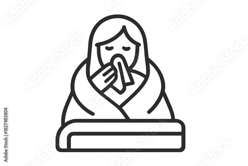 Unwell person wrapped in a warm blanket blowing their nose due to cold or flu symptoms
