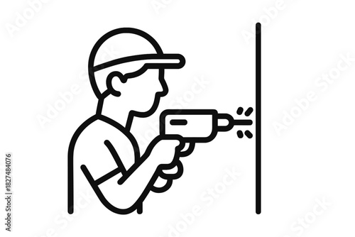 Construction worker drilling a hole in a wall during home renovation