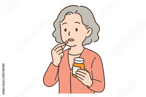 Elderly woman taking daily medication capsule from a prescription bottle