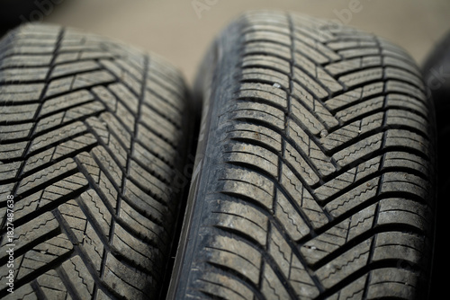 A close-up of the rubber tire treads from a car
