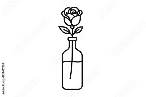 Elegant minimalist single rose flower with leaves inside a clear glass bottle vase