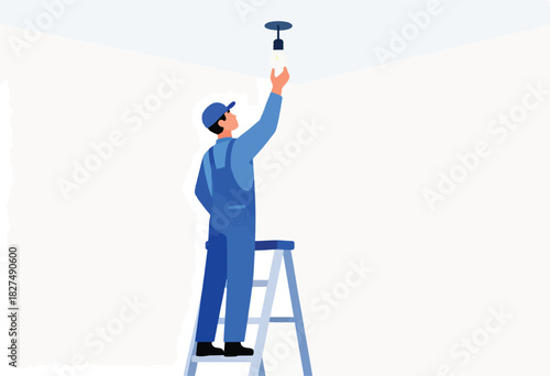 An electrician in blue overalls on a stepladder installs a lightbulb in a room with a white ceiling