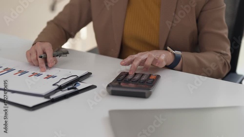 Asian senior entrepreneur working laptop modern office achieving business goals professional older woman leadership digital economy