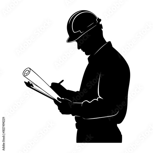 Silhouette of an engineer with hard hat reviewing blueprints and writing