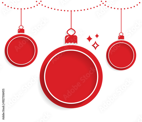 Red Christmas ornaments hanging from decorative garland