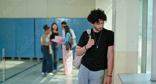 Indian sad young adult gen z man guy wear bag feel low look upset fail in study exam result indoor campus place alone lost tensed male boy suffer mental health issue social bully live bad hostel life