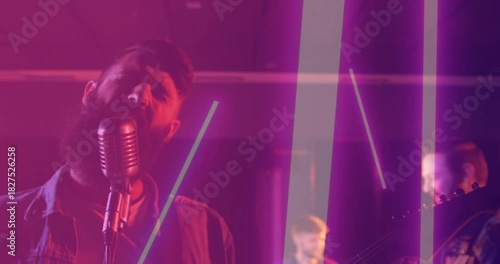 Lead singer leaning into vintage mic, cueing band performing music while neon bars overlaying band