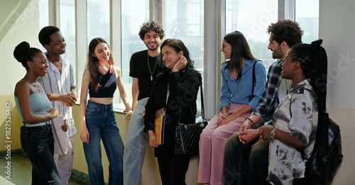 Fotografia Indian happy young adult tutor lady woman group talk casual gossip have fun joy enjoy new day spend break time indoor place