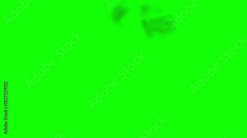 Aerial Explosion in varying Yellow and Orange Flames and Dense Grey Smoke with fast dissipation on uniform green background