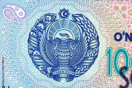 A 2017 banknote of 10000 Uzbek soums. The obverse depicts the state emblem. The reverse side of the banknote features an image of the Senate building in Tashkent.