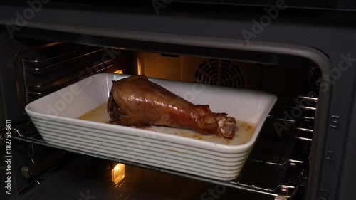 Cooking a turkey, roasting a turkey leg. Close-up of a turkey leg after roasting in the oven. A juicy roasted leg.