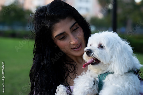 Woman holding maltese dog showing happiness bond