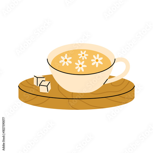 Warm chamomile tea cup with floral details and sugar cubes on a wooden coaster