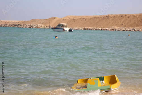 The Yellow Boat and the people having fun